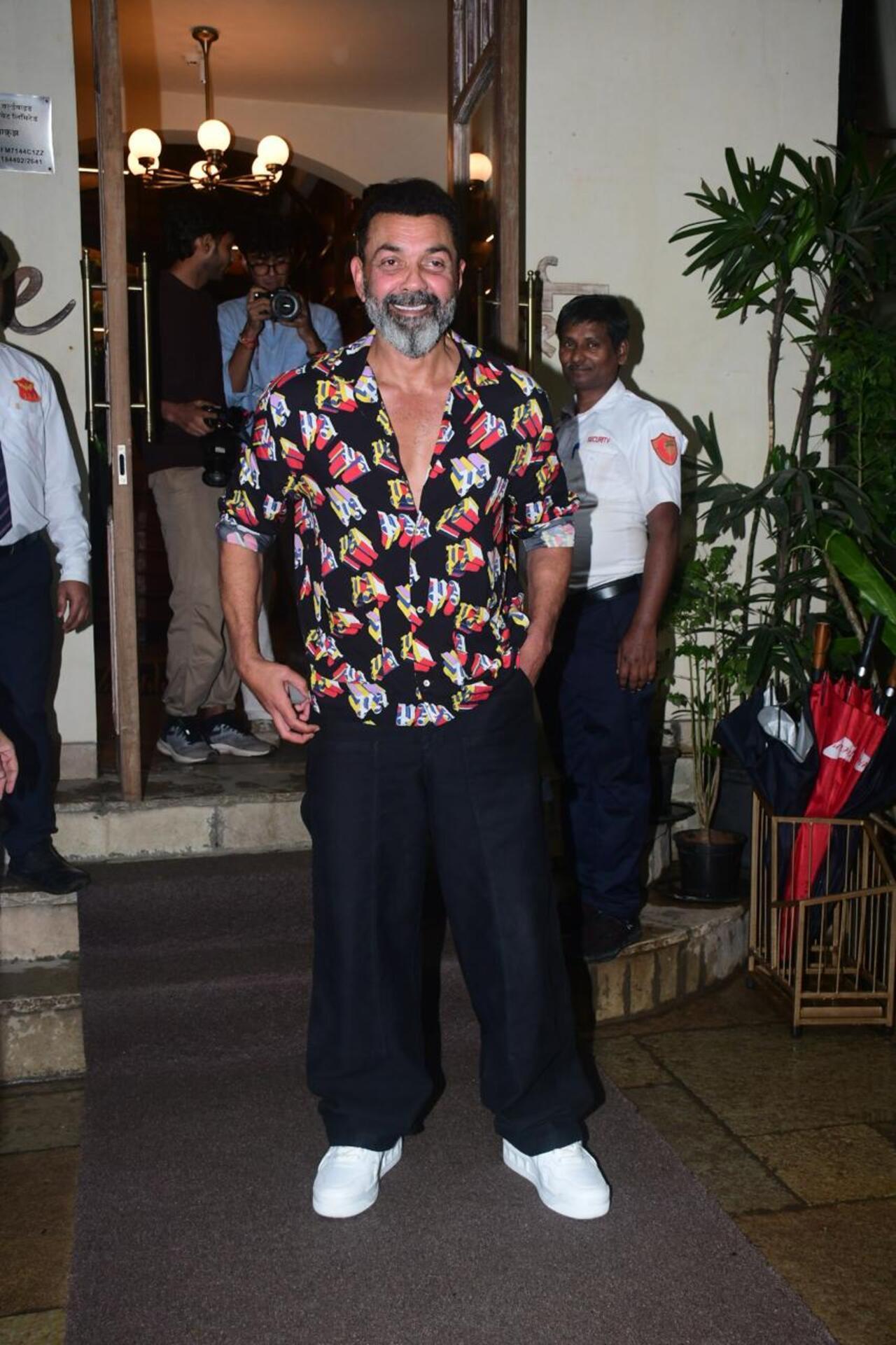 The Ba***ds of Bollywood star Bobby Deol was seen stepping out in the city in a casual and cool printed black shirt along with black baggy track pants.